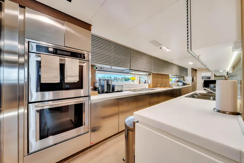  Yacht Photos Pics Modern kitchen interior on 2012 Azimut 116 yacht, featuring stainless steel appliances and sleek design.