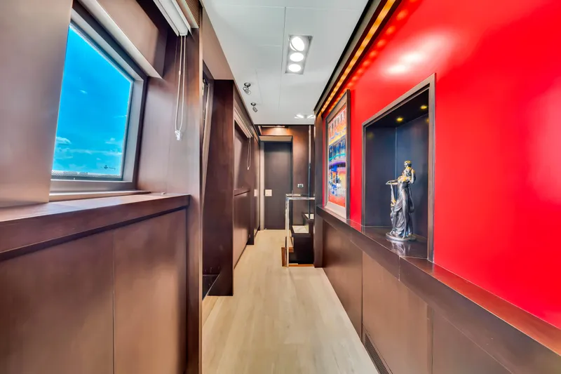  Yacht Photos Pics Luxurious interior hallway of 2012 Azimut 116 yacht with modern decor and vibrant red accents.