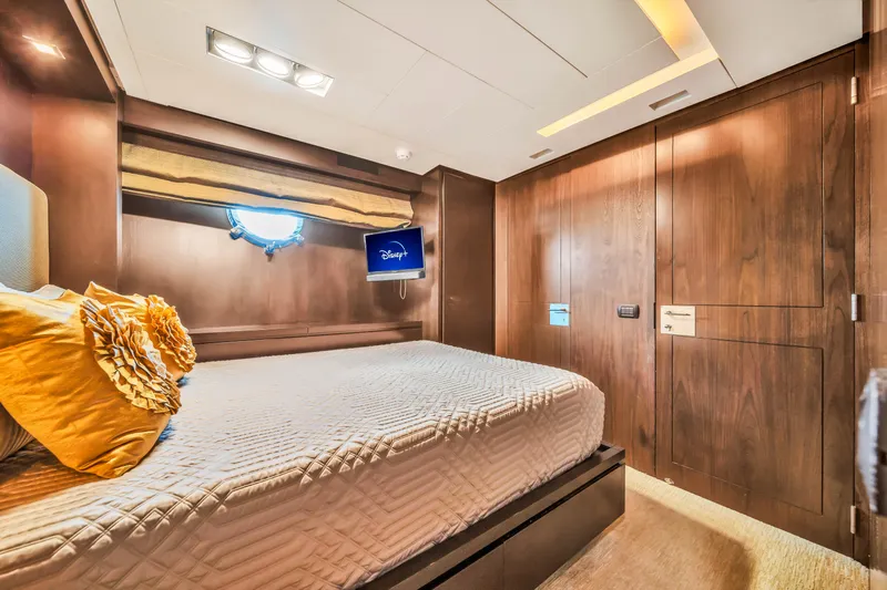  Yacht Photos Pics Luxurious bedroom interior on 2012 Azimut 116 yacht with elegant wood paneling and cozy bedding.