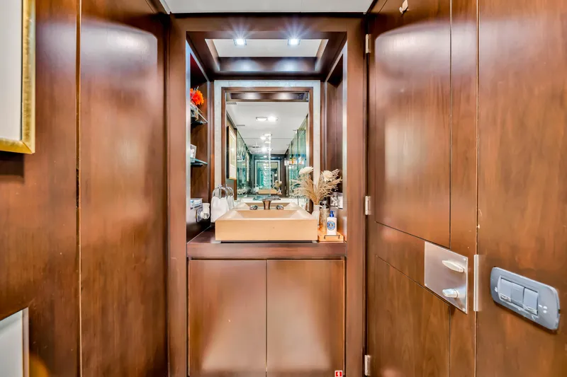  Yacht Photos Pics Luxurious bathroom interior on a 2012 Azimut 116 yacht, featuring elegant wood finishes.