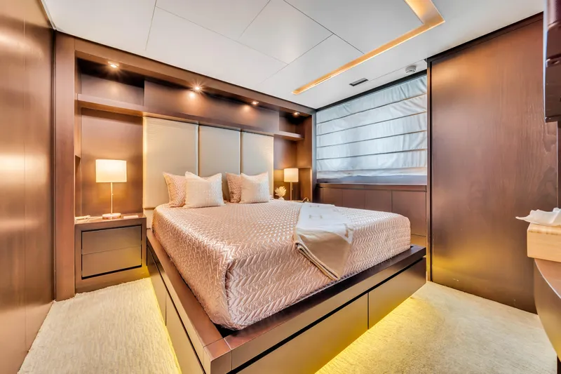  Yacht Photos Pics Luxurious bedroom interior of 2012 Azimut 116 yacht with modern design and ambient lighting.