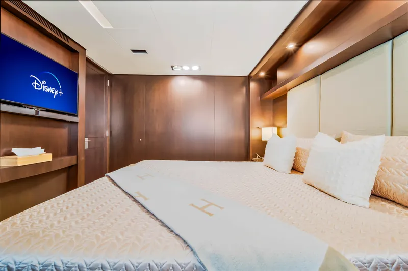  Yacht Photos Pics Luxurious bedroom on 2012 Azimut 116 yacht with TV and elegant bedding.