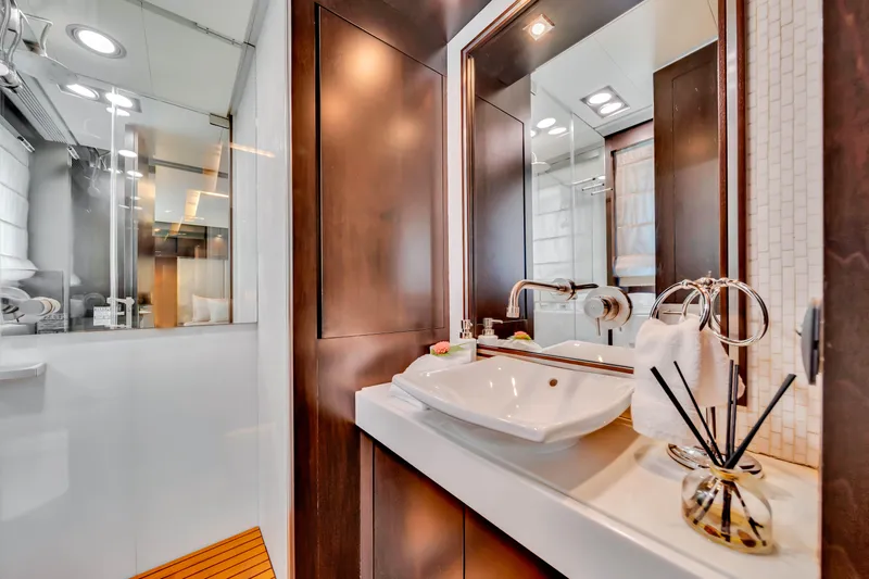  Yacht Photos Pics Luxurious bathroom interior on a 2012 Azimut 116 yacht, featuring modern sink and elegant decor.