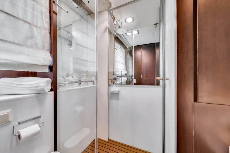  Yacht Photos Pics Luxurious bathroom interior on a 2012 Azimut 116 yacht, featuring modern fixtures and wooden accents.