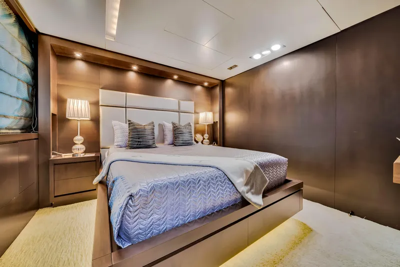  Yacht Photos Pics Luxurious bedroom interior on a 2012 Azimut 116 yacht, featuring elegant lighting and modern decor.