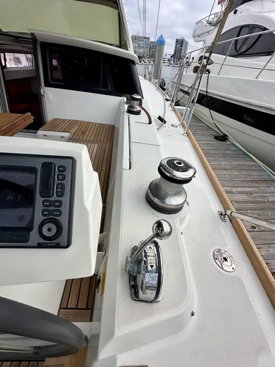 Doc Holiday Yacht Photos Pics Cockpit view of a 2012 Beneteau Sense 43 yacht, featuring navigation controls and winch.