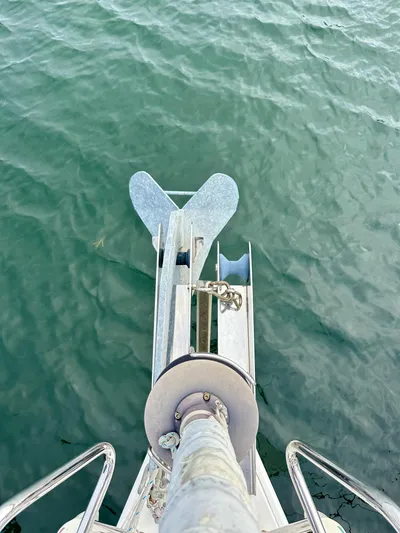 Doc Holiday Yacht Photos Pics Bow view of 2012 Beneteau Sense 43 sailboat with anchor over water.