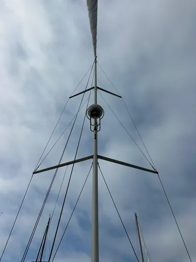 Doc Holiday Yacht Photos Pics Mast of 2012 Beneteau Sense 43 sailboat against cloudy sky.