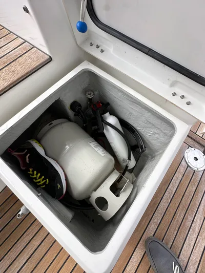 Doc Holiday Yacht Photos Pics Storage compartment on a 2012 Beneteau Sense 43 yacht with propane tank and shoes.