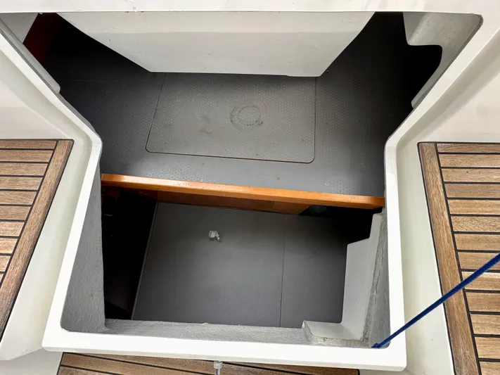 Doc Holiday Yacht Photos Pics Interior view of 2012 Beneteau Sense 43 yacht with wooden flooring and storage compartment.