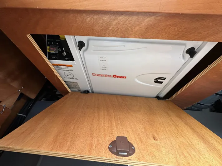 Doc Holiday Yacht Photos Pics Cummins Onan generator in 2012 Beneteau Sense 43 yacht, wooden compartment view.