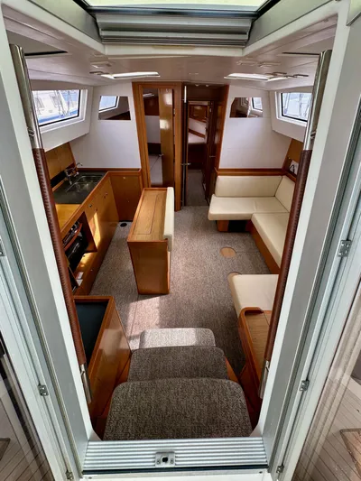 Doc Holiday Yacht Photos Pics Interior of 2012 Beneteau Sense 43 yacht, featuring modern kitchen and seating area.
