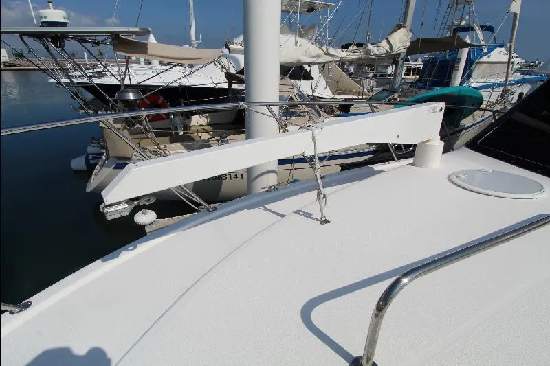  Yacht Photos Pics 2005 Riviera 46 Convertible Sportfisher docked at marina, showcasing sleek deck design.