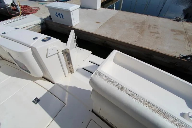  Yacht Photos Pics 2005 Riviera 46 Convertible Sportfisher docked, showing deck and marina area.