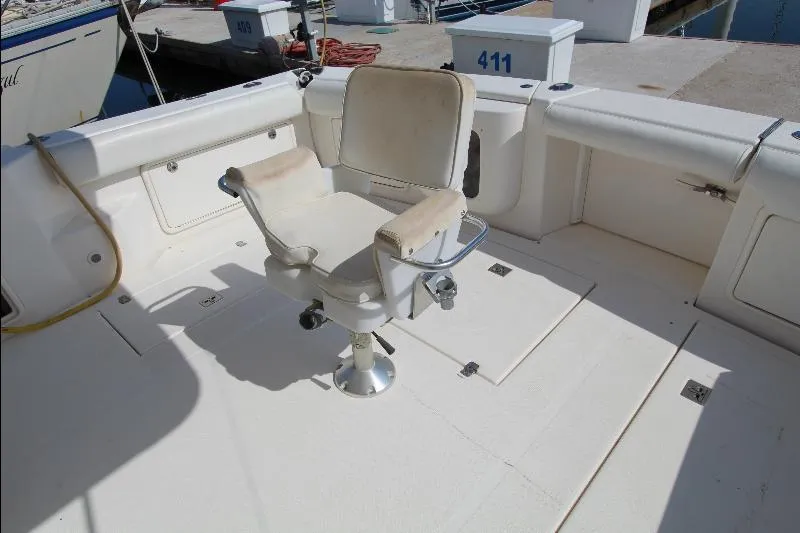  Yacht Photos Pics 2005 Riviera 46 Convertible Sportfisher cockpit with fishing chair and clean deck.