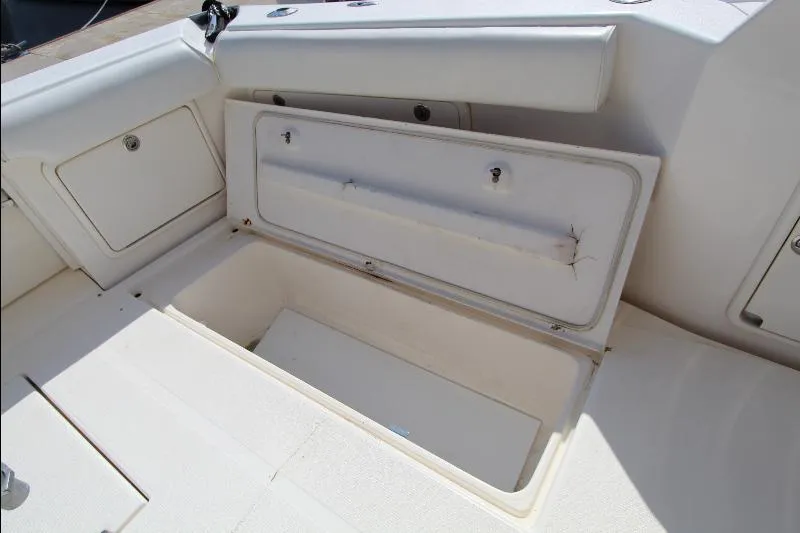  Yacht Photos Pics Open storage compartment on 2005 Riviera 46 Convertible Sportfisher boat deck.