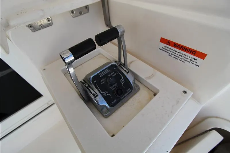  Yacht Photos Pics Throttle controls on a 2005 Riviera 46 Convertible Sportfisher boat cockpit.