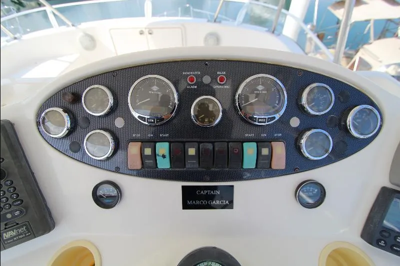  Yacht Photos Pics Control panel of 2005 Riviera 46 Convertible Sportfisher boat with gauges and switches.