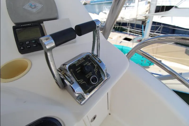  Yacht Photos Pics Control panel of a 2005 Riviera 46 Convertible Sportfisher boat, featuring throttle levers.