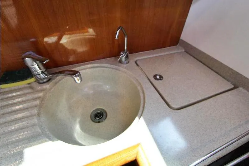  Yacht Photos Pics 2005 Riviera 46 Convertible Sportfisher kitchen sink with modern faucet and countertop.