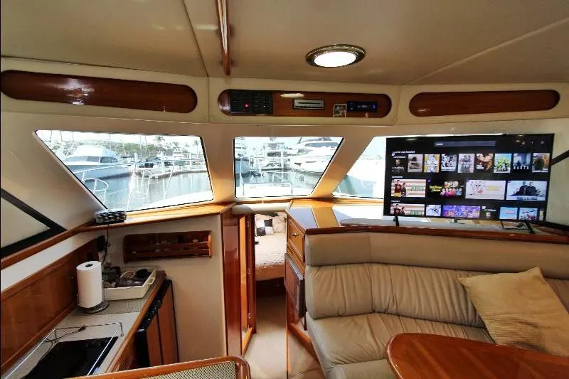  Yacht Photos Pics Interior of 2005 Riviera 46 Convertible Sportfisher yacht with modern amenities and marina view.