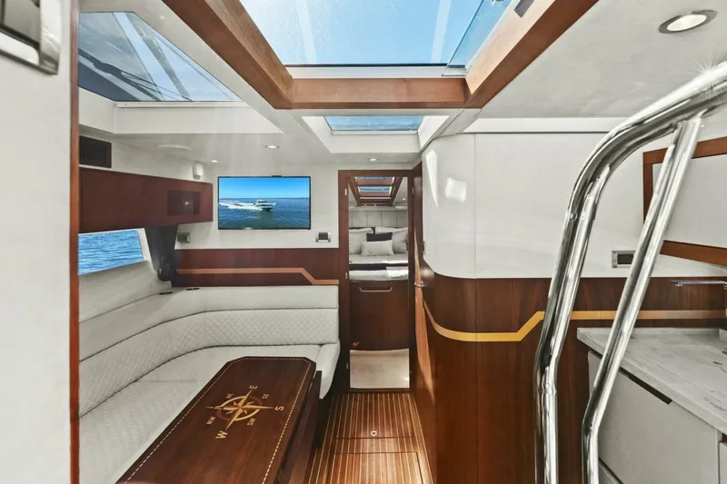 Board Room Yacht Photos Pics Interior of 2017 Galeon 385 HTS yacht with elegant wood finish and modern design.