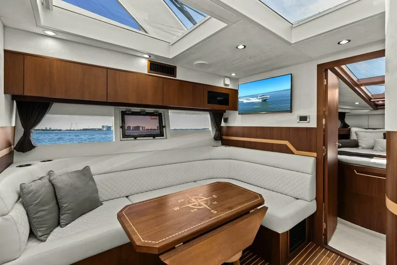 Board Room Yacht Photos Pics Luxurious interior of 2017 Galeon 385 HTS yacht with elegant seating and modern design.