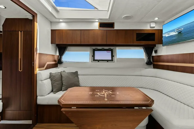 Board Room Yacht Photos Pics Luxurious interior of 2017 Galeon 385 HTS yacht with elegant seating and modern decor.