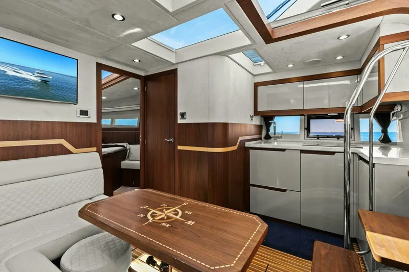 Board Room Yacht Photos Pics Luxurious interior of 2017 Galeon 385 HTS yacht with modern design and wood accents.