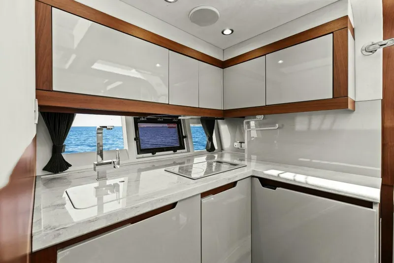 Board Room Yacht Photos Pics Luxurious kitchen interior of 2017 Galeon 385 HTS yacht with ocean view.
