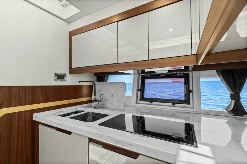 Board Room Yacht Photos Pics Modern kitchen interior of 2017 Galeon 385 HTS yacht with ocean view.