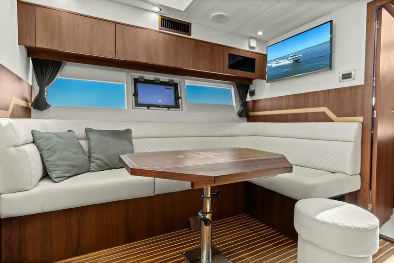 Board Room Yacht Photos Pics Luxurious interior of 2017 Galeon 385 HTS yacht with elegant seating and modern decor.