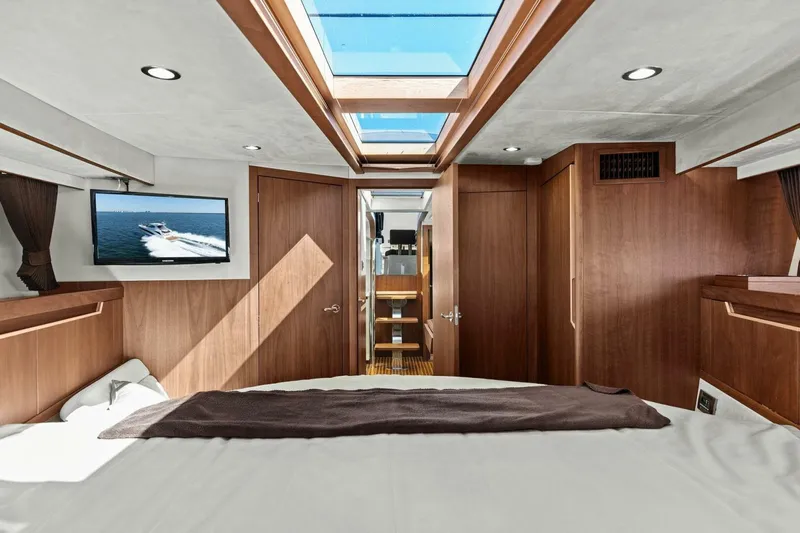 Board Room Yacht Photos Pics Luxurious interior of 2017 Galeon 385 HTS yacht with wood finish and skylight.