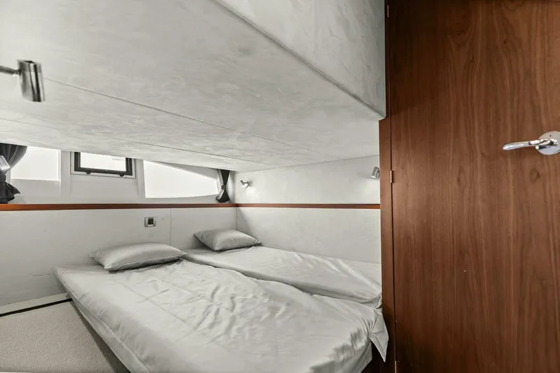 Board Room Yacht Photos Pics 2017 Galeon 385 HTS yacht cabin with twin beds, modern design, and wooden accents.