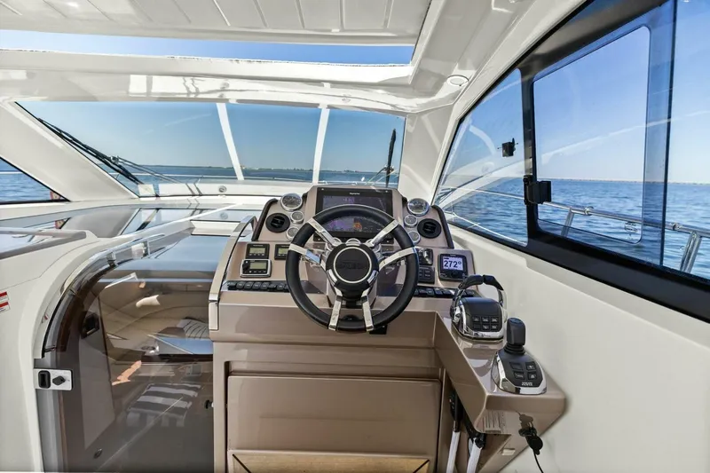 Board Room Yacht Photos Pics Helm of 2017 Galeon 385 HTS yacht with modern navigation equipment and ocean view.