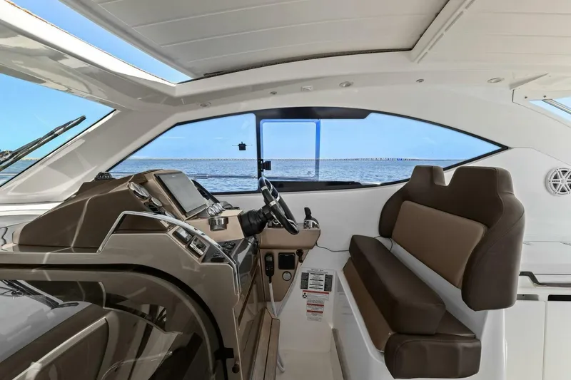 Board Room Yacht Photos Pics Interior of 2017 Galeon 385 HTS yacht, featuring modern helm and seating.