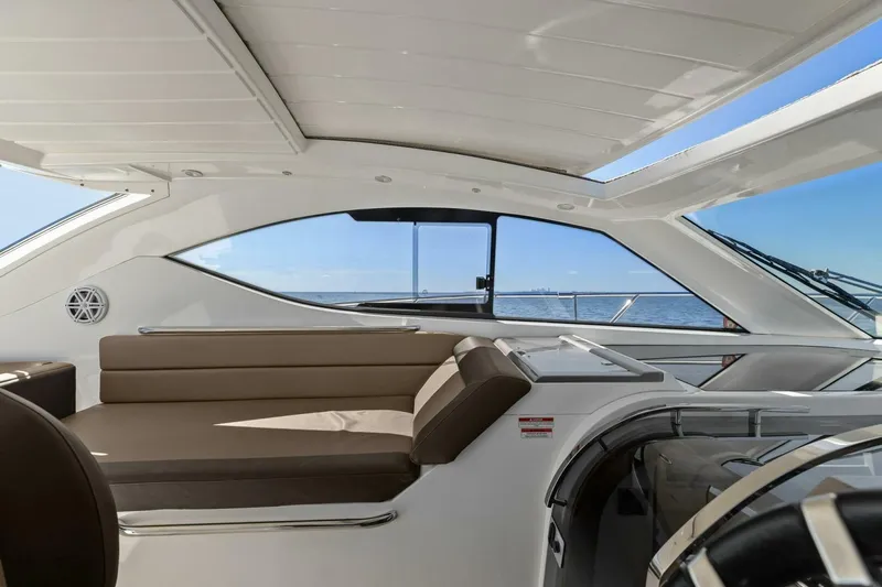 Board Room Yacht Photos Pics Interior of 2017 Galeon 385 HTS yacht with ocean view through windows.