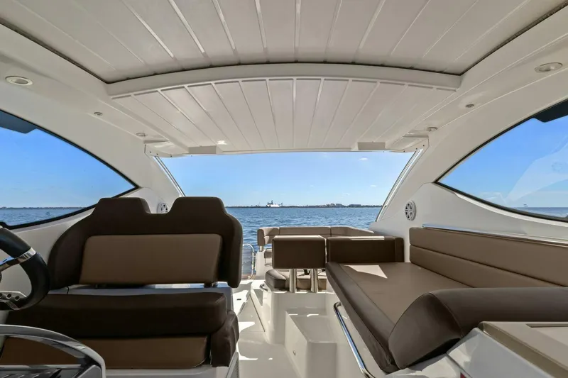 Board Room Yacht Photos Pics Interior view of 2017 Galeon 385 HTS yacht with ocean backdrop.