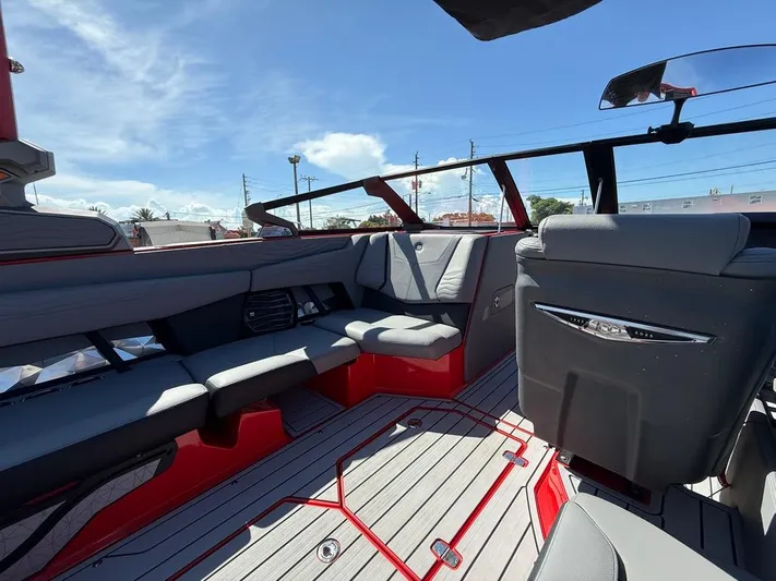  Yacht Photos Pics Interior of 2025 Nautique Super Air Nautique G23 boat, featuring sleek seating and modern design.