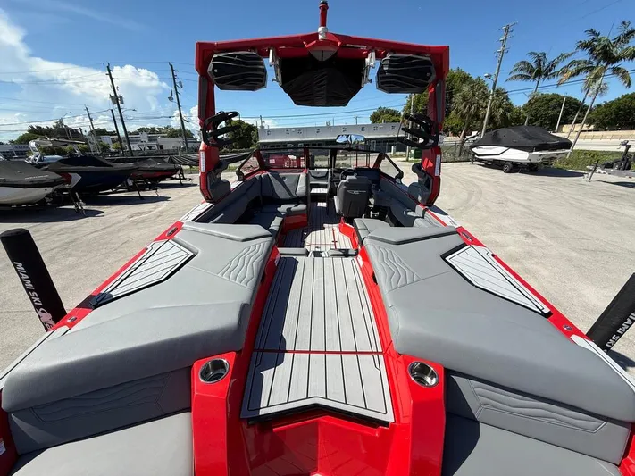  Yacht Photos Pics 2025 Nautique Super Air Nautique G23 interior, featuring sleek design and spacious seating.