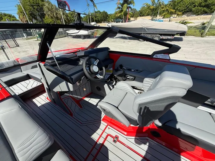  Yacht Photos Pics 2025 Nautique Super Air Nautique G23 interior with sleek design and modern controls.