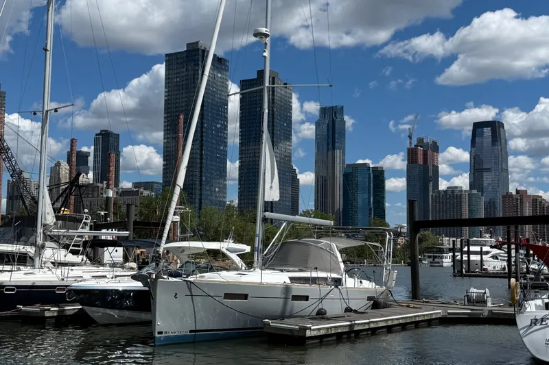 Wind Waker Yacht Photos Pics Beneteau Oceanis 41 sailboat docked in a marina with city skyline, 2013 model.
