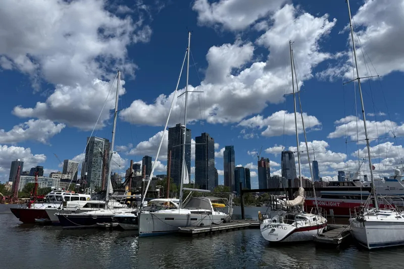 Wind Waker Yacht Photos Pics Sailboats docked at a marina with city skyline, featuring a 2013 Beneteau Oceanis 41.