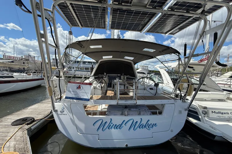 Wind Waker Yacht Photos Pics Beneteau Oceanis 41 sailboat, 2013 model, docked with solar panels and "Wind Waker" name.