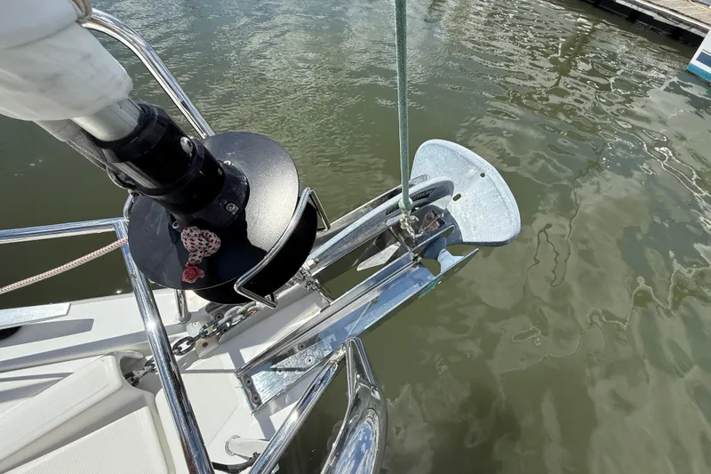 Wind Waker Yacht Photos Pics Anchor and bow of 2013 Beneteau Oceanis 41 sailboat on calm water.