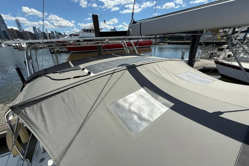 Wind Waker Yacht Photos Pics 2013 Beneteau Oceanis 41 sailboat with solar panels docked in a marina.