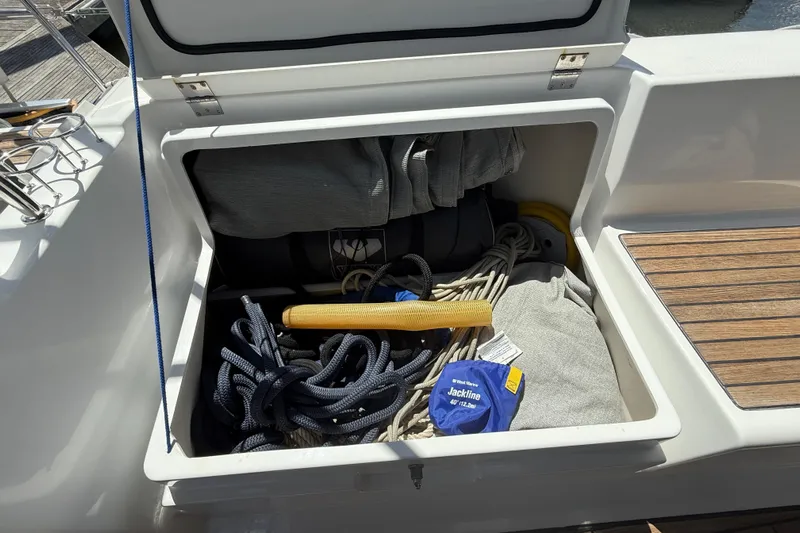 Wind Waker Yacht Photos Pics Storage compartment on a 2013 Beneteau Oceanis 41 sailboat with ropes and gear.