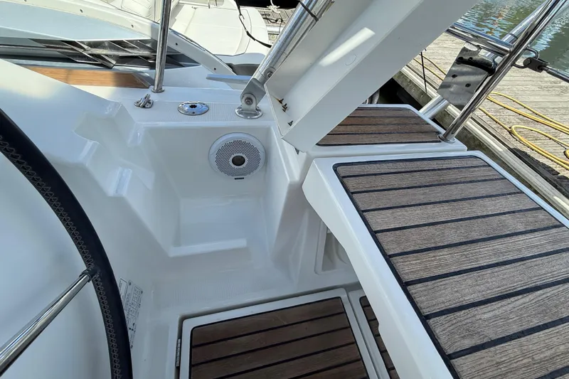 Wind Waker Yacht Photos Pics Cockpit area of 2013 Beneteau Oceanis 41 sailboat with wooden decking and speaker.
