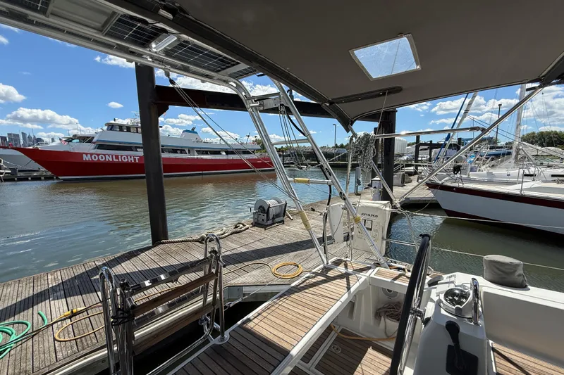 Wind Waker Yacht Photos Pics 2013 Beneteau Oceanis 41 yacht docked at marina, with boats and clear sky in background.