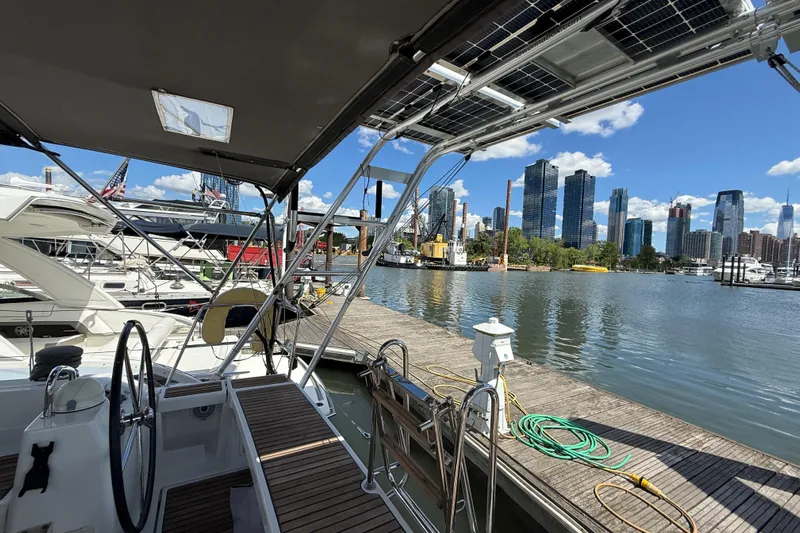 Wind Waker Yacht Photos Pics Beneteau Oceanis 41 sailboat docked with city skyline in the background, 2013 model.